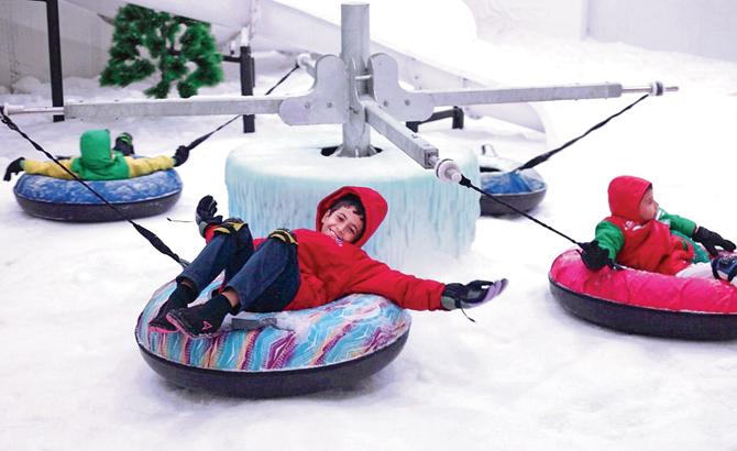 Kids enjoying the carousel at Snow Rush