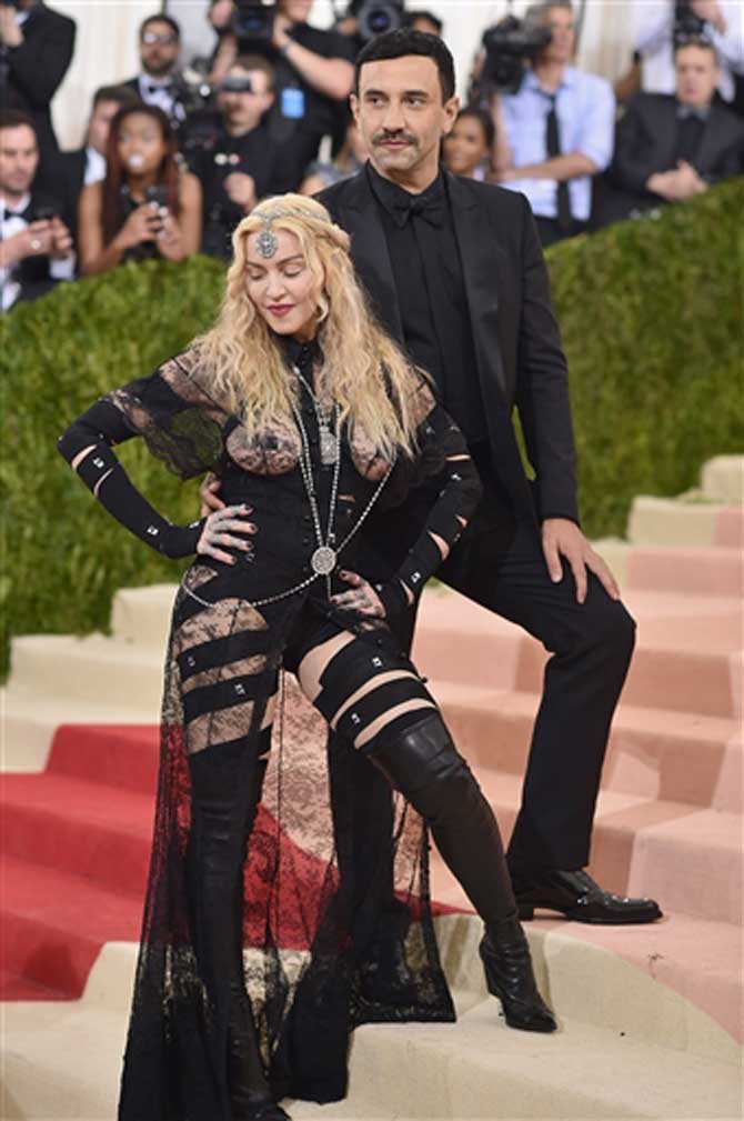 Riccardo Tisci and Madonna attend the 