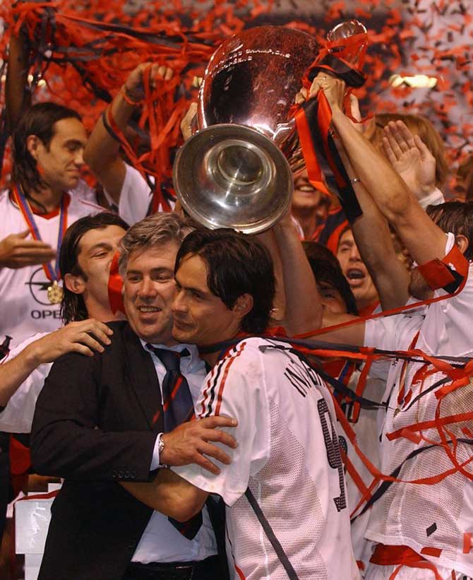 Milan AC forward Italian Filippo Inzaghi (R) and coach Carlo Ancelotti jubilate after winning the European Champions League Final Match against Juventus at Old Trafford Stadium, 28 May 2003 in Manchester