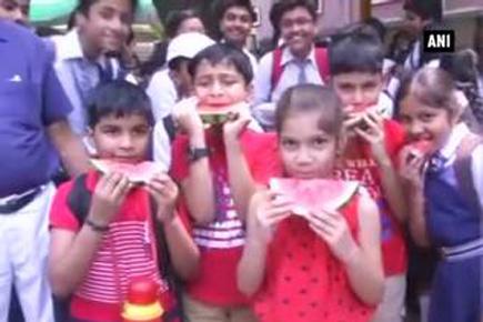 Beat the heat: School distributes watermelons