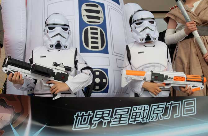 Two children strike a pose dressed as the Star Wars white knights during the annual Star Wars Day in Taipei on Wednesday. Pic/AFP