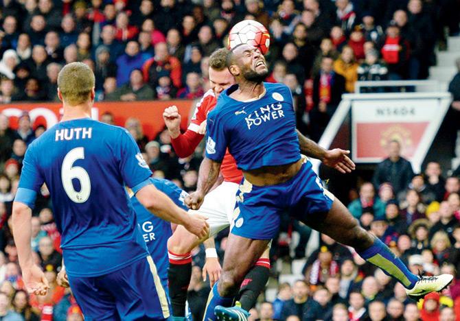 Leicester City’s captain Wes Morgan (right), who scored the equalising goal, vies for the ball with Manchester United’s Juan Mata during an English Premier League match  at Old Trafford in Manchester yesterday. Pic/AFP
