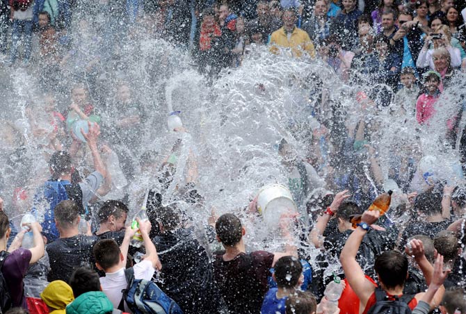People spray water on one another as they celebrate Clean Monday in Lviv, western Ukraine. Pic/AFP