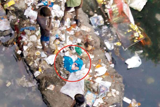 The spot (circled) where the baby was found amidst garbage