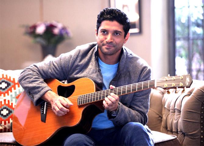 Farhan Akhtar playing guitar on Vogue BFFs. Pic/IANS