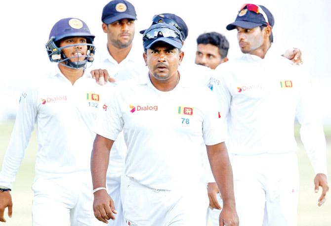 Rangana Herath leads his team during the Harare Test. Pic/AFP