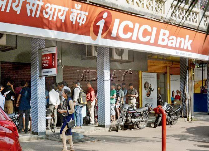 People queue outside ICICI Bank in sector-44, Nerul, Navi Mumbai. Pic/Sneha Kharabe