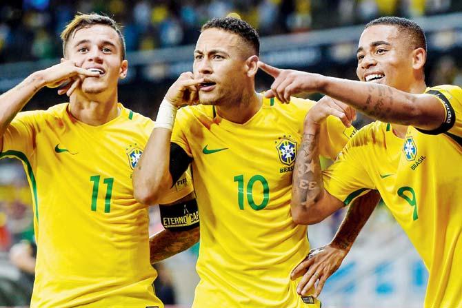 Brazil’s Philippe (left), Neymar and Gabriel celebrate a goal against Argentina during the match in Brazil yesterday. Pics/Getty Images