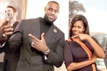LeBron James takes a selfie with US First Lady Michelle Obama at the White House