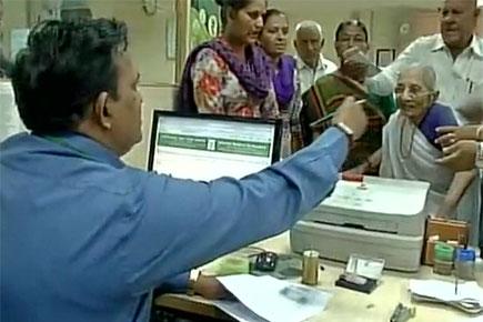 Video: Narendra Modi's old mother visits bank to exchange notes