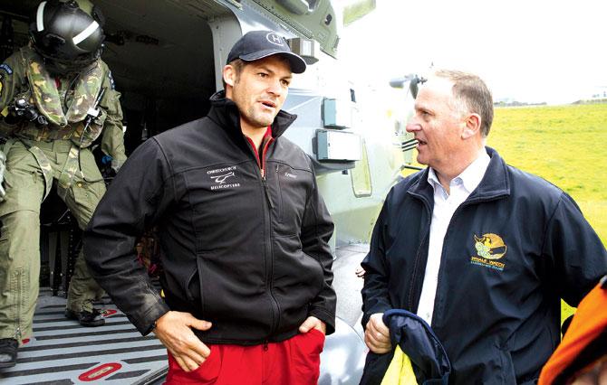New Zealand Prime Minister John Key (right) meets former All Blacks captain Richie McCaw during his visit to Kaikoura on the South Island