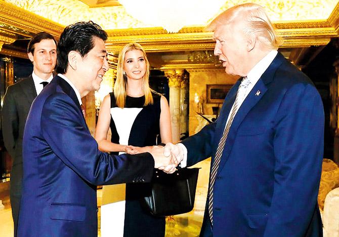 US President-elect Donald Trump welcomes Japanese PM Shinzo Abe, as Ivanka Trump and her husband Jared Kushner look on, in New York. Abe described Trump as a "trustworthy leader" after meeting him to get clarity on statements he’d made while campaigning, causing concern about the alliance. Pic/AFP