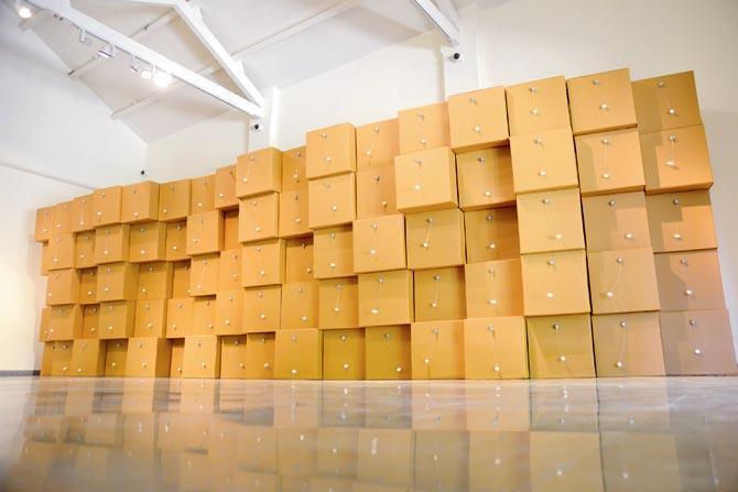 Zimoun’s sound sculpture comprising 80 prepared DC motors, cotton balls  and cardboard boxes 