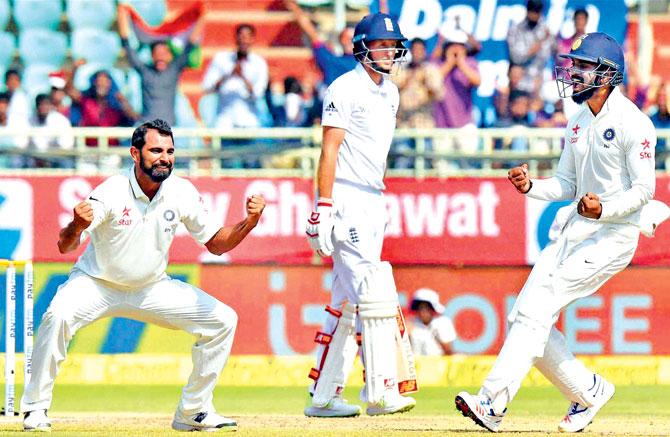 India seamer Mohammed Shami (left) exults after dismissing England batsman Joe Root (centre) in Visakhapatnam yesterday. Pic/PTI