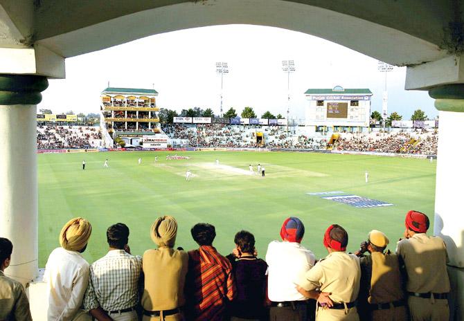 Police and spectators watch the action during Day Three of the Second Test between India and England at the PCAâÂÂÂu00c2u0080ÂÂÂu00c2u0088Stadium in Mohali on March 11, 2006. Pics/Getty Images