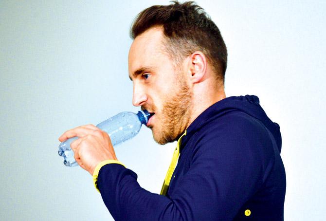 South Africa skipper Faf du Plessis sips a drink as he attends a press conference ahead of the third and final Test against Australia in Adelaide yesterday. Pic/AFP