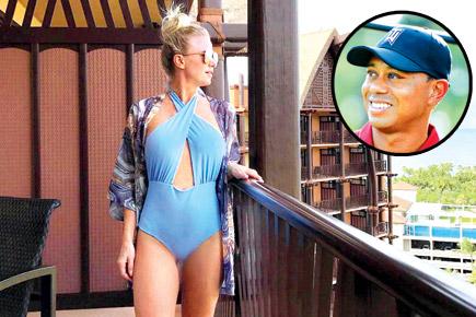 Tiger Woods has a new chick and is ready to flaunt her in the Bahamas