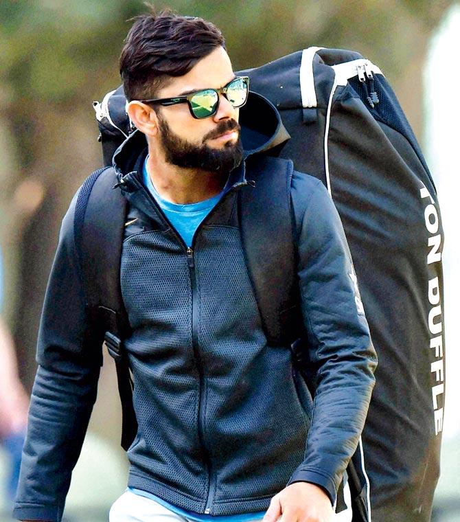 Captain Virat Kohli leaves the ground after practice on the eve of the third Test between India and England at the Punjab Cricket Association Stadium in Mohali yesterday. Pic/PTI