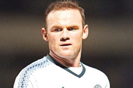 Wayne Rooney backs football abuse helpline