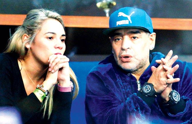 Football legend Diego Maradona and his companion Rocio Oliva watch the Davis Cup singles match in Zagreb on Friday. Pic/AP/PTI