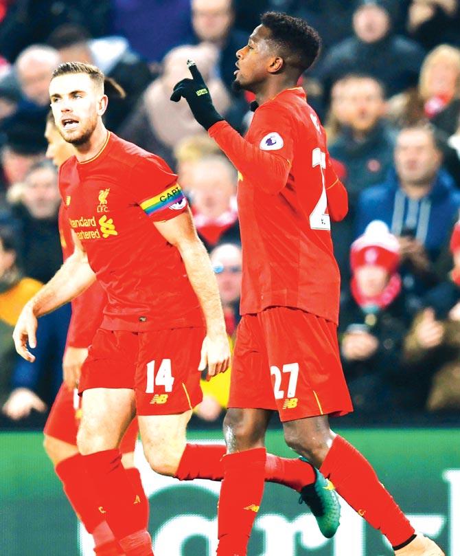 Liverpool striker Divock Origi (right) celebrates scoring in their EPL match against Sunderland in Anfield on Saturday. Pic/AFP