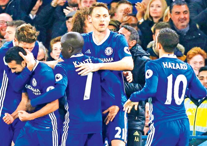 Chelsea players celebrate a goal during an EPL match against Tottenham at Stamford Bridge in London on Saturday. Pic/AFP