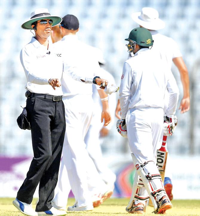 Umpire Kumar Dharmasena signals for a review on Day Five of the first Test between Bangladesh and England at Zohur Chowdhury Stadium in Chittagong on October 24. Pic/Getty Images