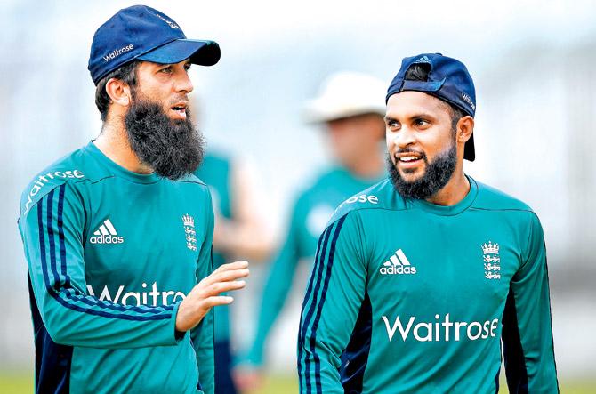 ECB is happy with security arrangements in India, especially concerning Moeen Ali (left) and Adil Rashid. Pic/Getty Images