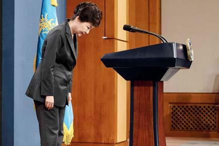 South Korea president says scandal 'my fault', denies cult links