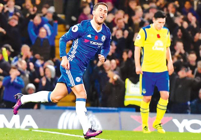 Chelsea midfielder Eden Hazard celebrates after scoring a goal during the Premier League match against Everton on Saturday. Pic/AFP