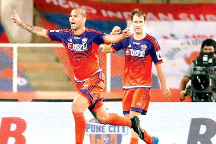 FC Pune City's Eduardo Ferreira (left) celebrates after scoring against ATK during the match held at Balewadi yesterday. Pic/ISL