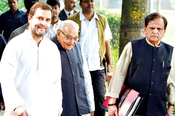 Congress vice-president Rahul Gandhi with party leaders Motilal Vohra and Ahmed Patel arrive for the CWC meeting. Pic/PTI