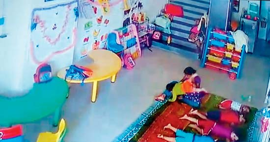 CCTV grabs show how the maid flung the baby and also hit and kicked her