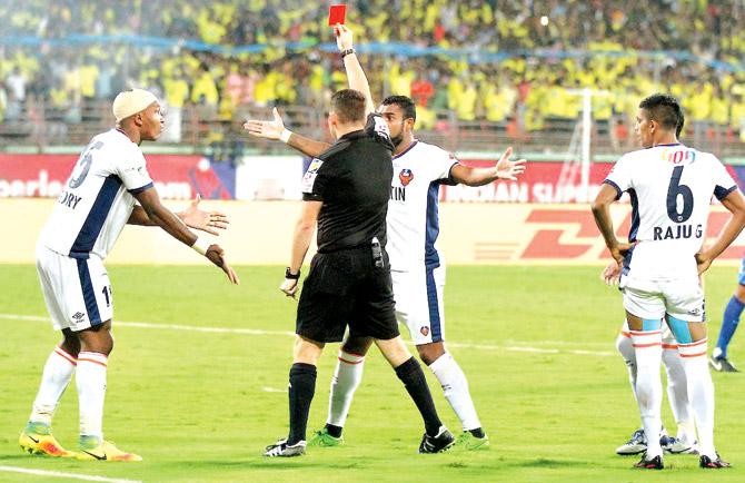 Referee shows a red card to FC Goa