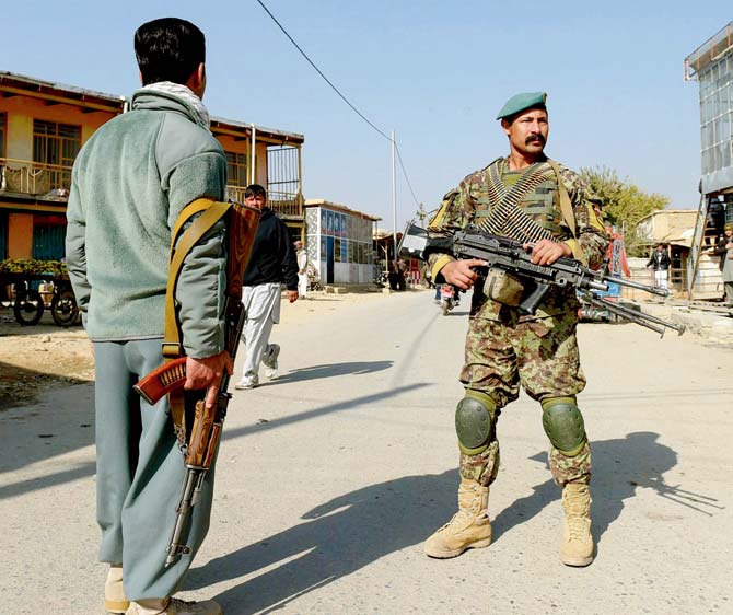 Afghan security personnel at the US military base. Pic/AFP
