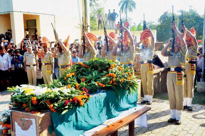 BSF men pay tribute to martyr Sambhu Satmura who died in a land mine blast in Jammu Kashmir, at his funeral at Agartala. Pic/PTI