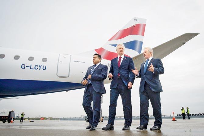 British secretary of state for exiting the European Union (Brexit minister) David Davis (C) with aviation minister Lord Ahmad (L) and chief executive of London City Airport, Declan Collier (R) at the airport during a visit to host a roundtable discussion. Pic/AFP