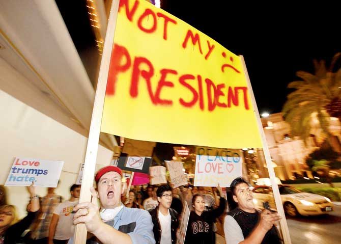 Demonstrators turned out in thousands to protest against US President-elect Donald Trump. Pic/AFP