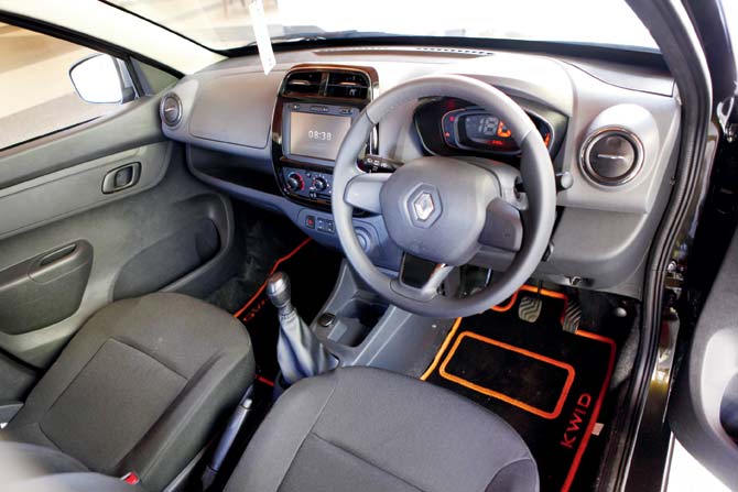 The already decent interior has been given additional styling like the orange-piped floor mats