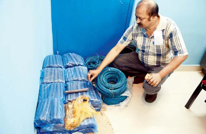 Policeman shows the recovered gelatine sticks and codrex wire at a police station in Siliguri. Pic/AFP