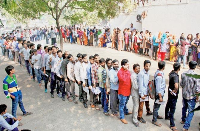 People standing in queues to exchange their old Rs 500 and Rs 1,000 notes in Gurugram on Friday. Pic/PTI