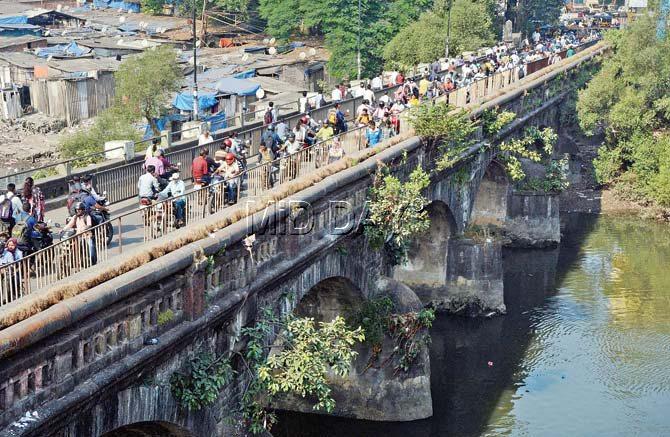 When mid-day visited the bridge a week ago, motorists and pedestrians were still using it. Pic/Satej Shinde