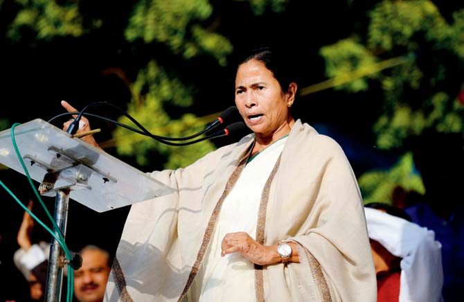 Mamata Banerjee speaks at the demonstration. Pic/AFP