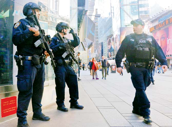 The NYPD anti-terror unit patrol Times Square in New York. Pic/AP