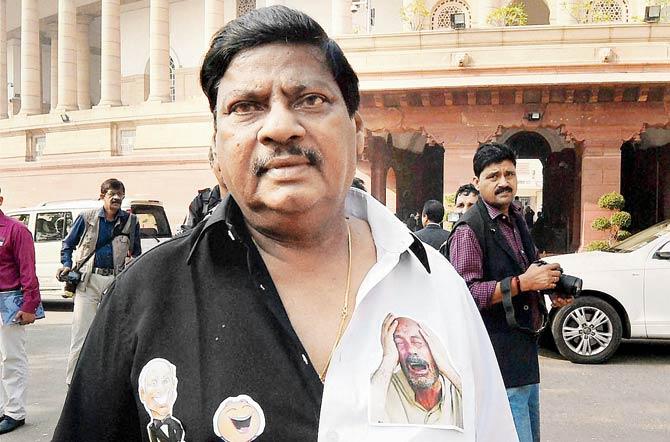 TDP MP Naramalli Shivprasad at Parliament in a shirt commenting on demonetisation, with pictures of farmers on one side and rich people on the other. PIC/PTI