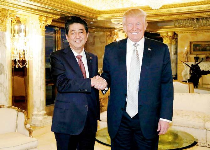 Japanese PM Shinzo Abe (left) was the first foreign leader to meet US President-elect Donald Trump on Thursday. PM Modi had apparently asked Abe to put in a word on his behalf with Trump for a pre-inauguration meeting. Pic/AFP