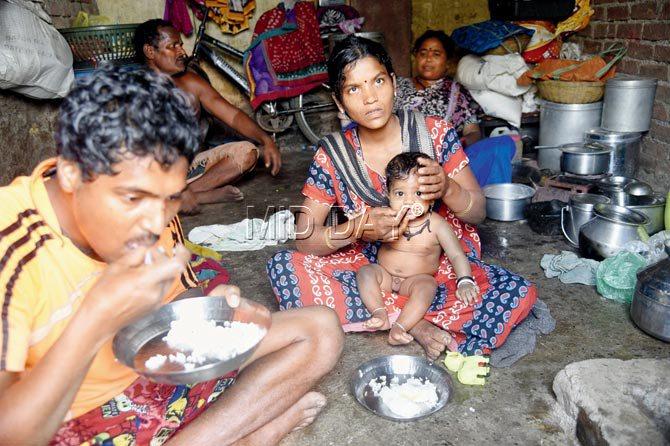 Parshuram Chavan’s family, including his infant son, has eaten nothing but plain boiled rice for over a week, since shops no longer accept their money. Pics/Sameer Markande