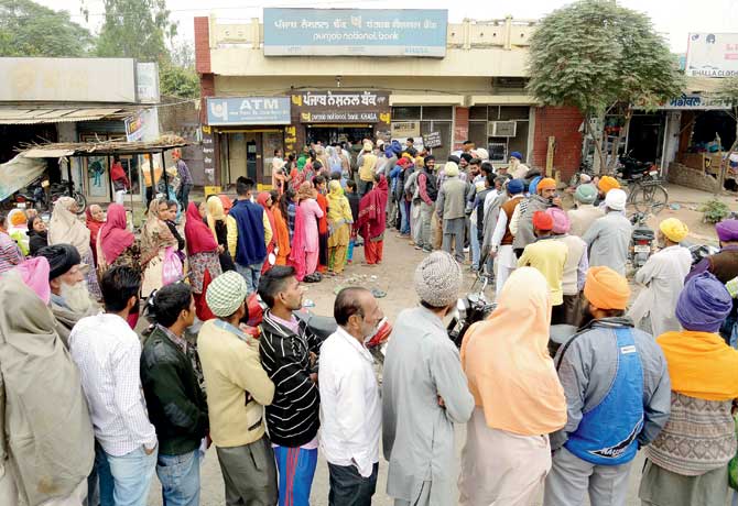 Across the nation, people are queuing up outside banks like this one in Amritsar to withdraw cash or exchange old currency for new. Pic/AFP