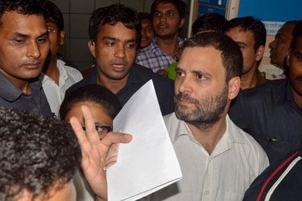 Rahul Gandhi visits bank to exchange old notes, hits out at PM