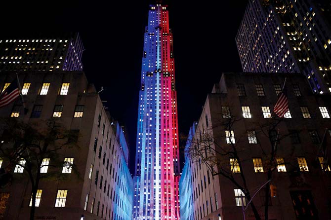 Rockefeller Center and Rockefeller Plaza is lit up in red and blue to mark electoral progress of Hillary Clinton and Donald Trump. Pic/AFP